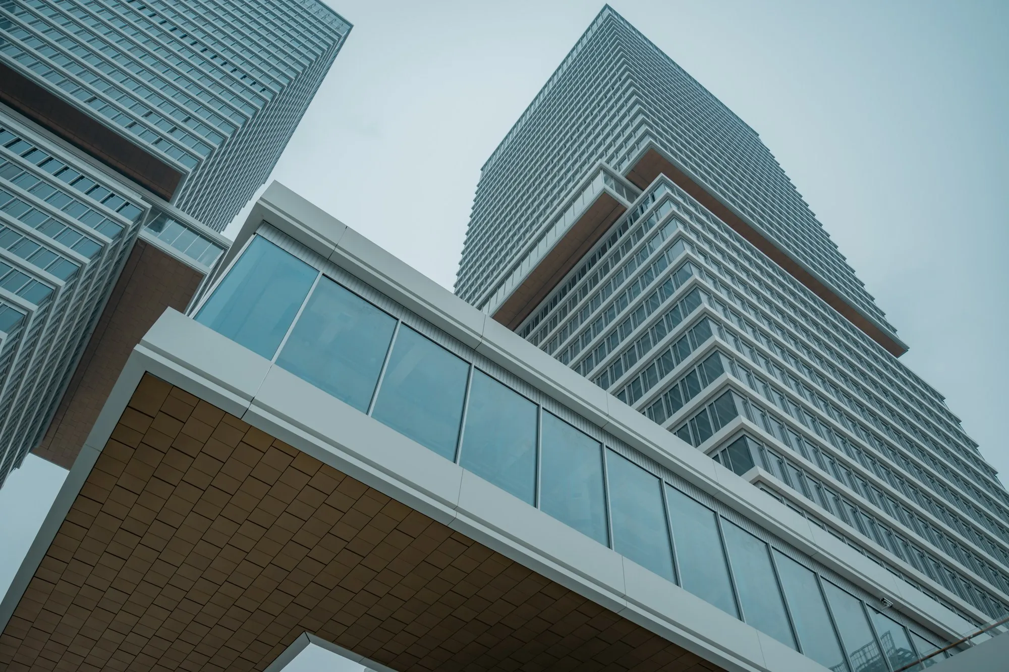 Glass office tower viewed from below